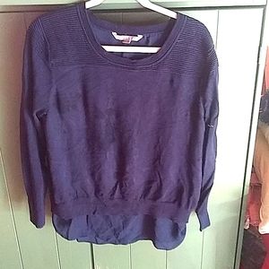 Navy knit sweater with silk underlay.